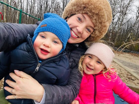 Mom and her two kids at playground.